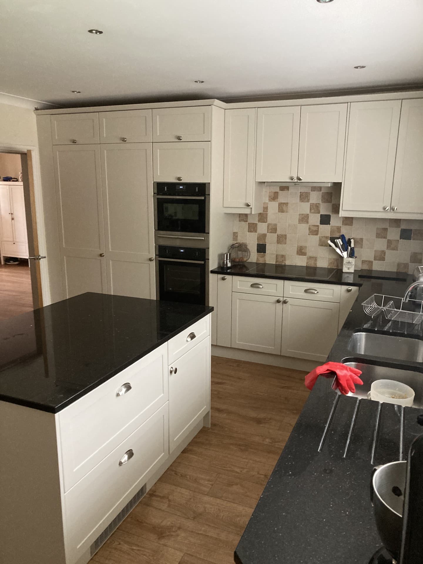 Cream shaker kitchen with black worktop after Kitchen Reno door replacement